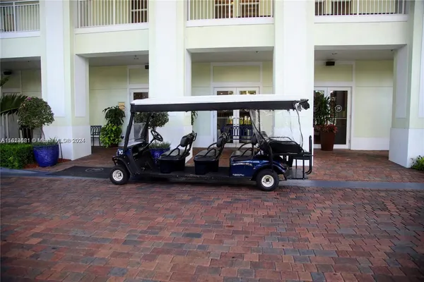 a view of car parked in front of garage