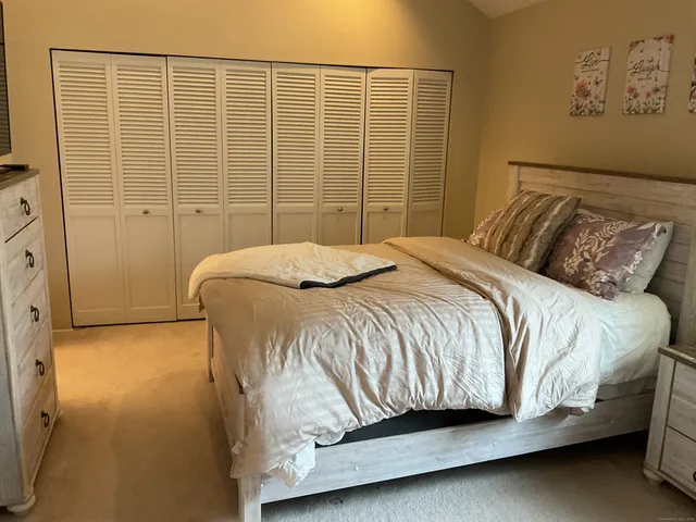 a bathroom with a toilet and a mirror