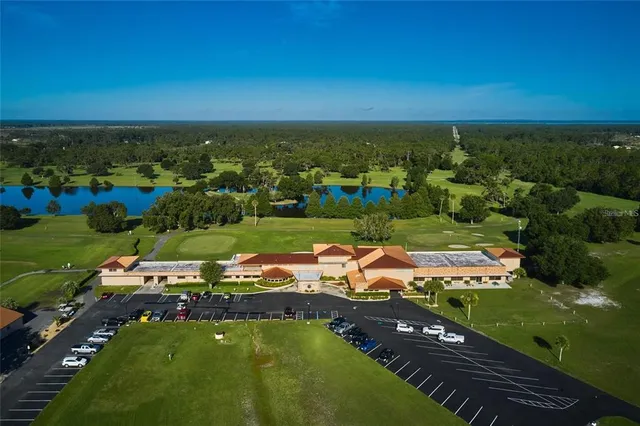 an aerial view of a houses with a yard