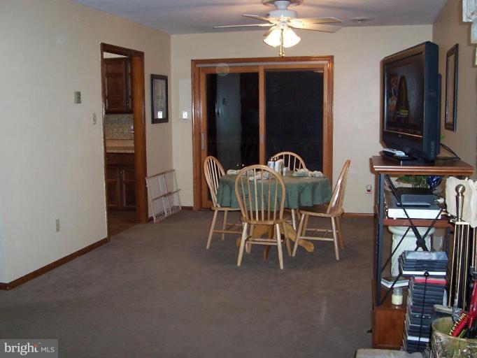 3329 Lineboro Road Manchester, MD 21102 - Photo 14 of 19 a dining room with furniture and chandelier