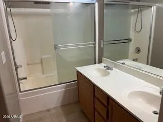 a bathroom with a sink and mirror