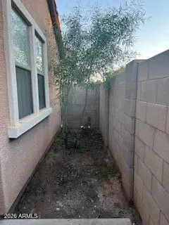 a view of a pathway besides a house