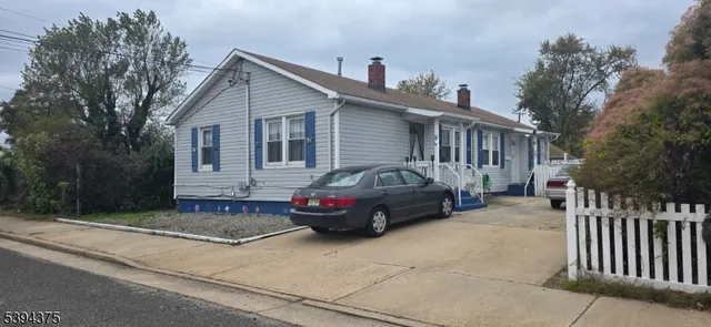 a front view of a house with a garage