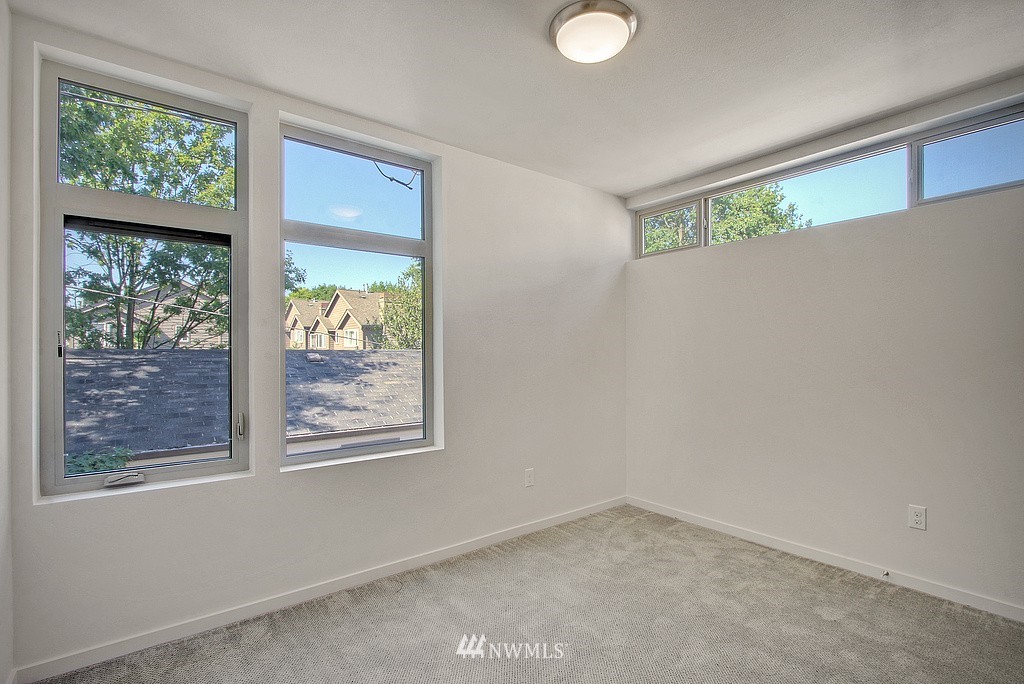 300 26th Avenue South, Unit B Seattle, WA 98144 - Photo 9 of 13 an empty room with windows