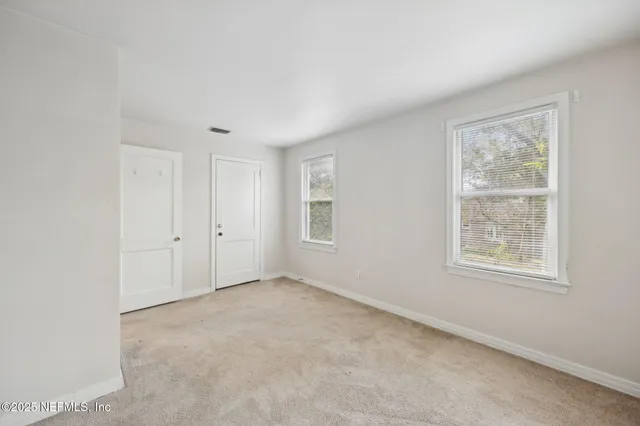 an empty room with windows