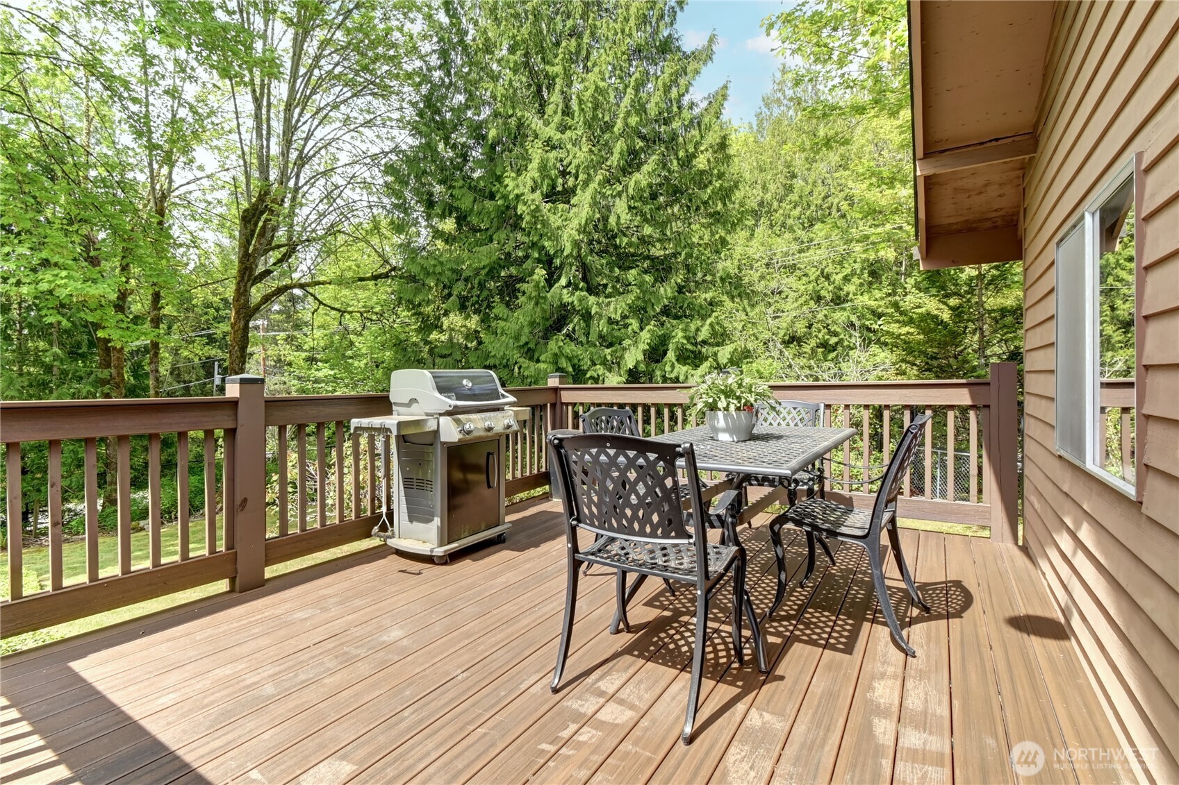 28539 Northeast Tolt Hill Road Carnation, WA 98014 - Photo 29 of 36 a view of a roof deck with table and chairs and wooden floor