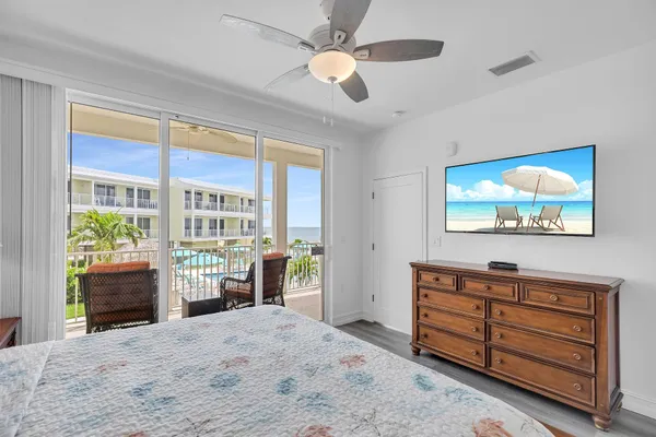 a bedroom with furniture and a window