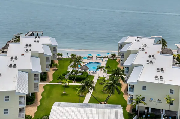 an aerial view of residential houses with outdoor space