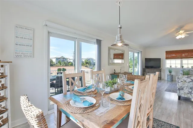 a kitchen with stainless steel appliances granite countertop a sink a stove and refrigerator