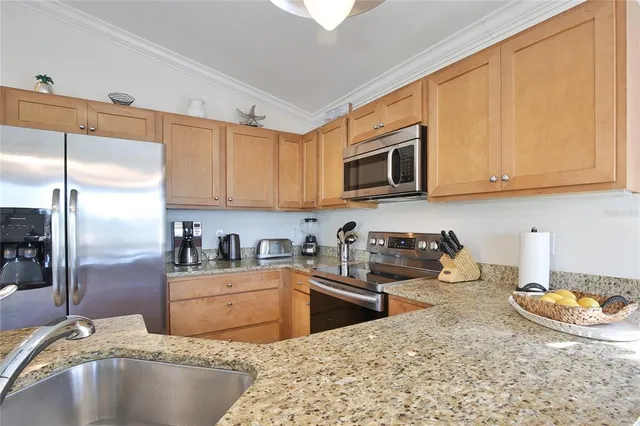 a bedroom with two beds and a chandelier