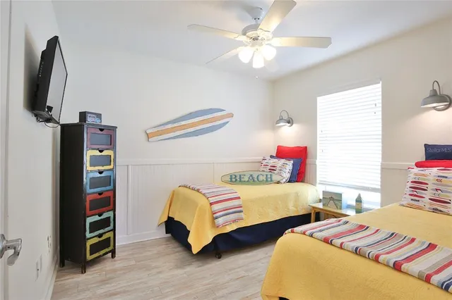 a bedroom with a bed dresser and a window