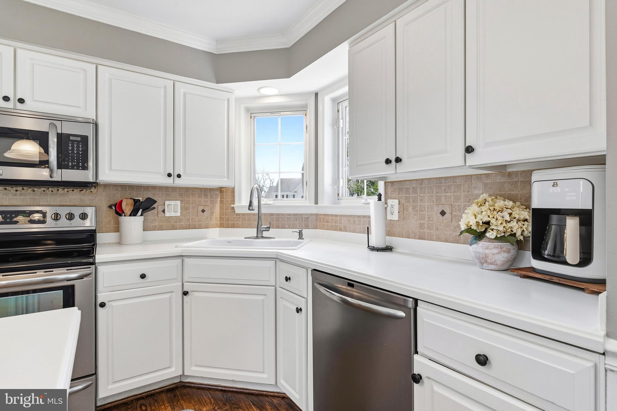 9 Penny Lane Perryville, MD 21903 - Photo 15 of 33 a kitchen with granite countertop white cabinets and white appliances