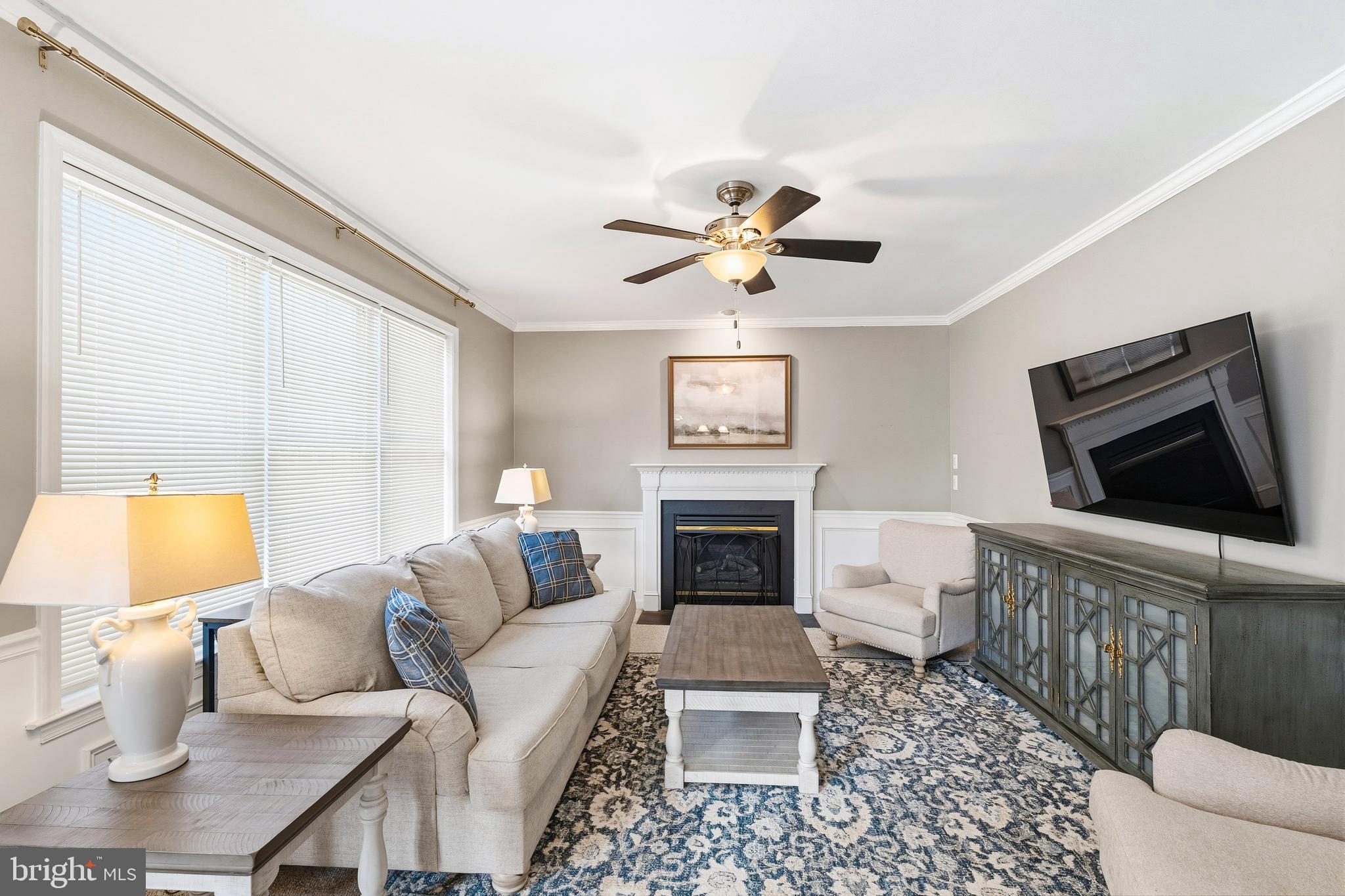 9 Penny Lane Perryville, MD 21903 - Photo 17 of 33 a living room with furniture a flat screen tv and a fireplace
