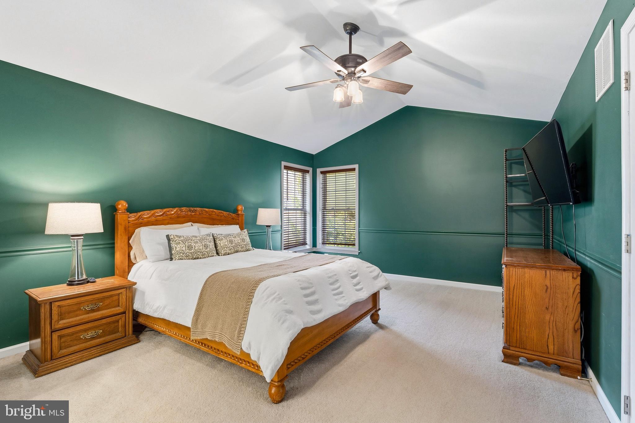 9 Penny Lane Perryville, MD 21903 - Photo 21 of 33 a bedroom with a bed and a chandelier
