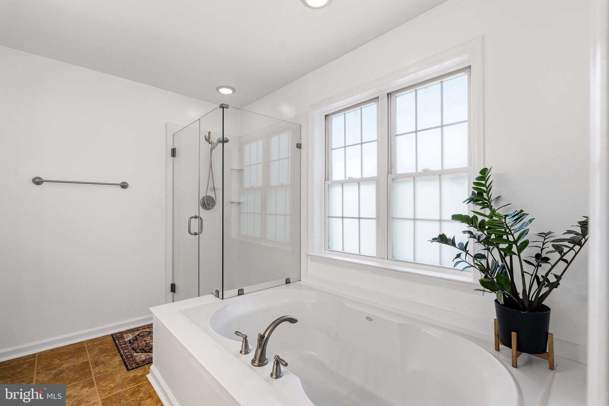 9 Penny Lane Perryville, MD 21903 - Photo 23 of 33 a white bath tub sitting in a bathroom next to a window