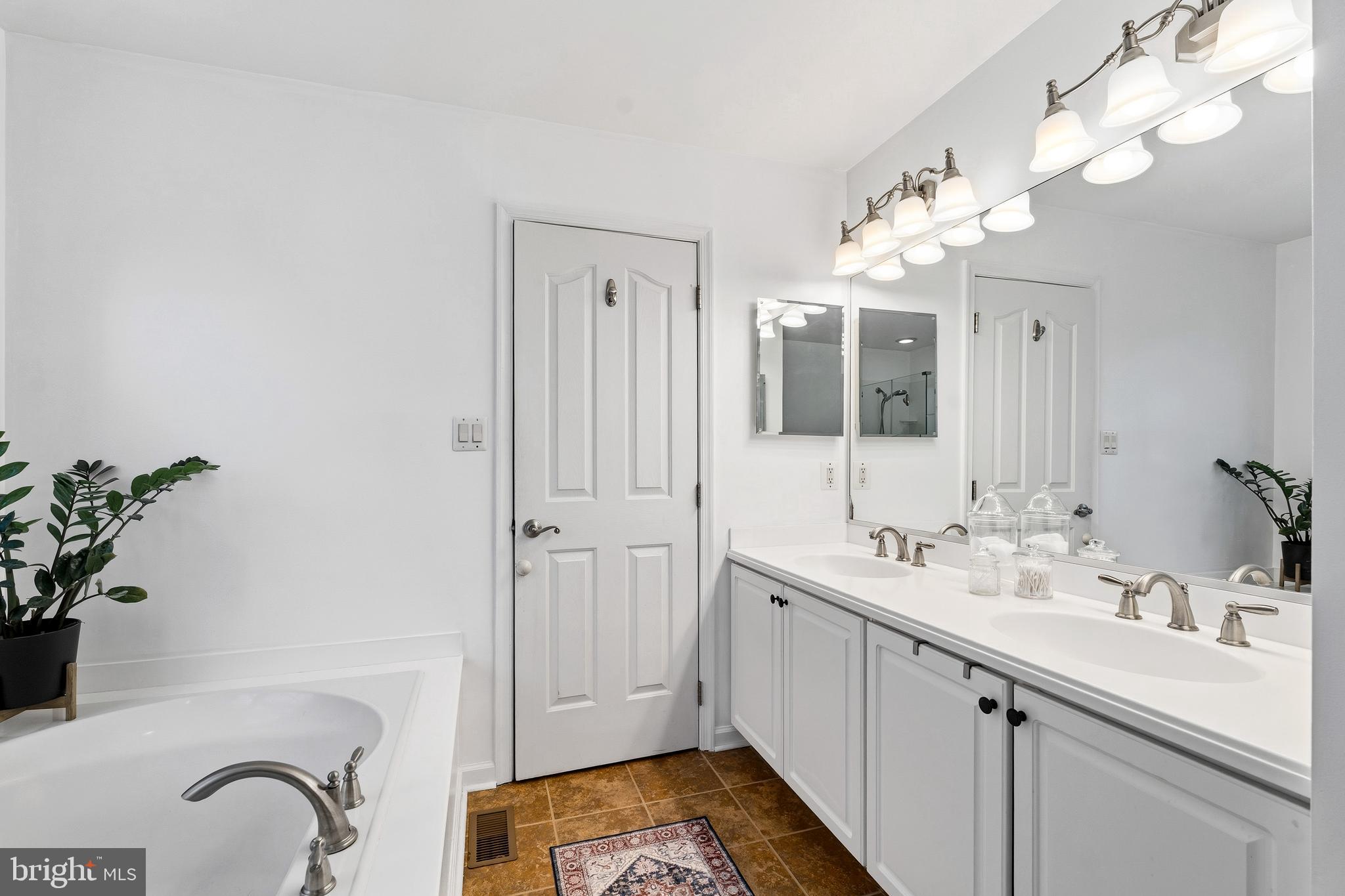 9 Penny Lane Perryville, MD 21903 - Photo 24 of 33 a spacious bathroom with a double vanity sink mirror and