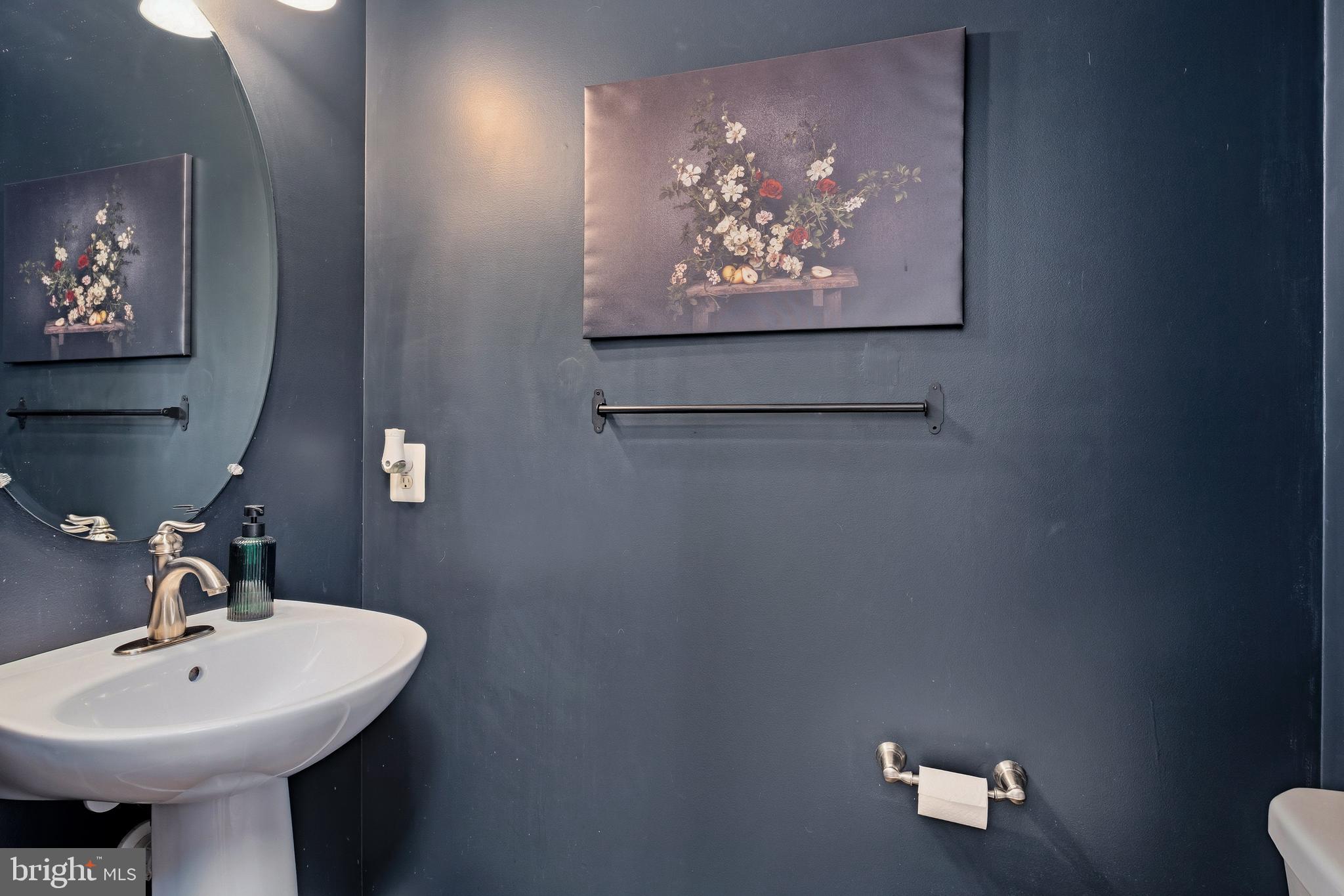 9 Penny Lane Perryville, MD 21903 - Photo 7 of 33 a bathroom with a sink and a mirror