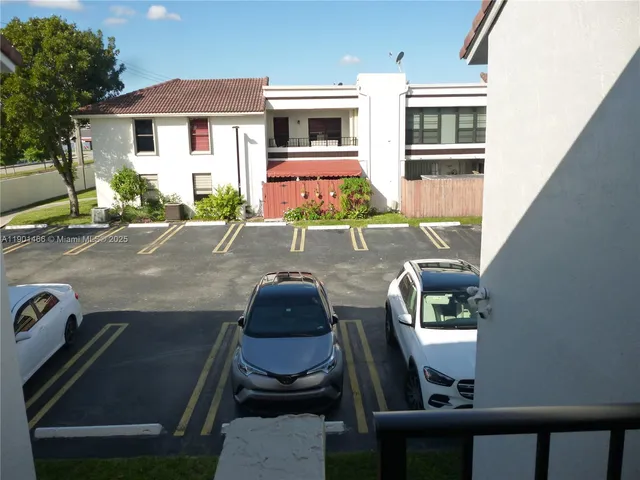 a front view of a house with sitting area