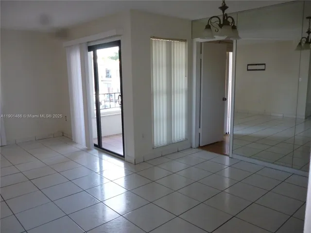 an empty room that has a window in it