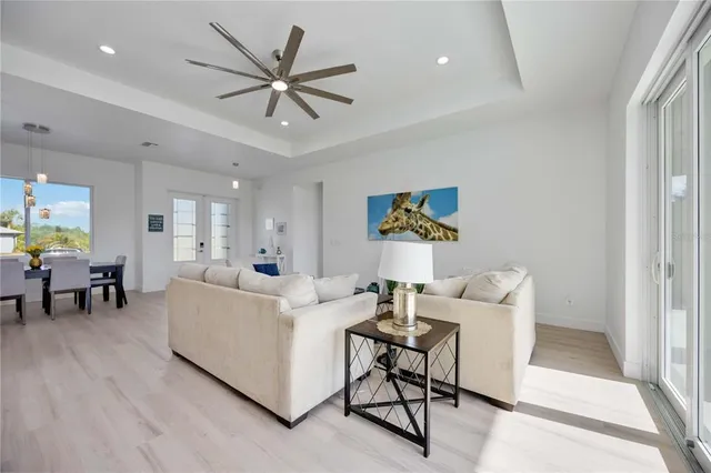 a living room with furniture white walls and white walls