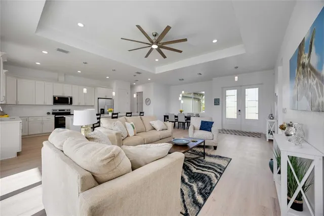 a view of kitchen with cabinets table and chairs