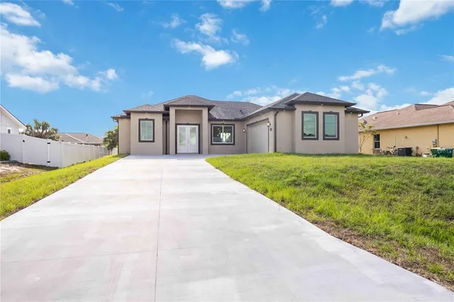 a view of a house with a backyard
