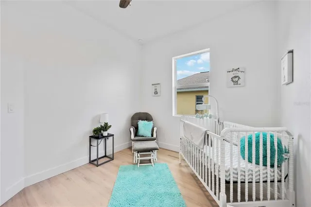 a spacious bedroom with a bed and furniture