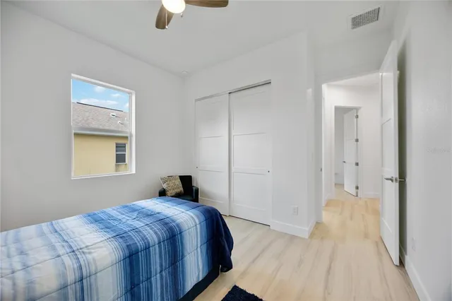 a view of a porch with furniture and floor to ceiling window