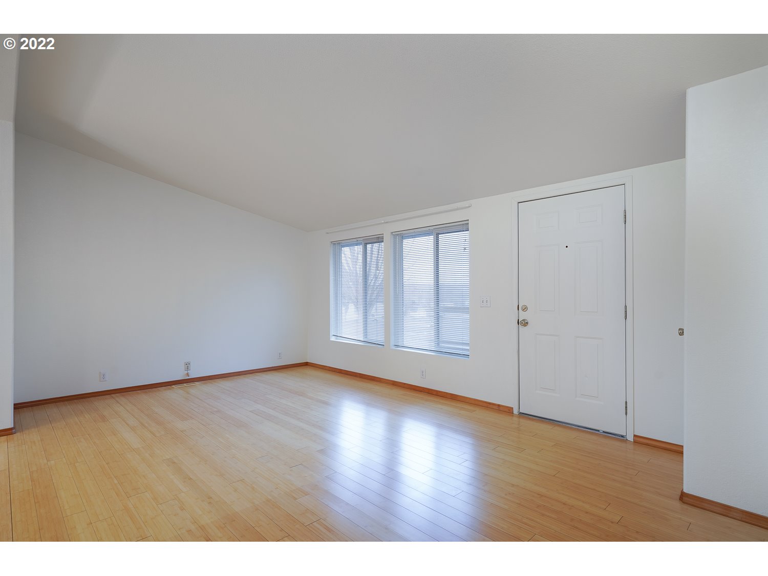 30668 Spring Court Hermiston, OR 97838 - Photo 11 of 23 a view of an empty room with wooden floor and a window