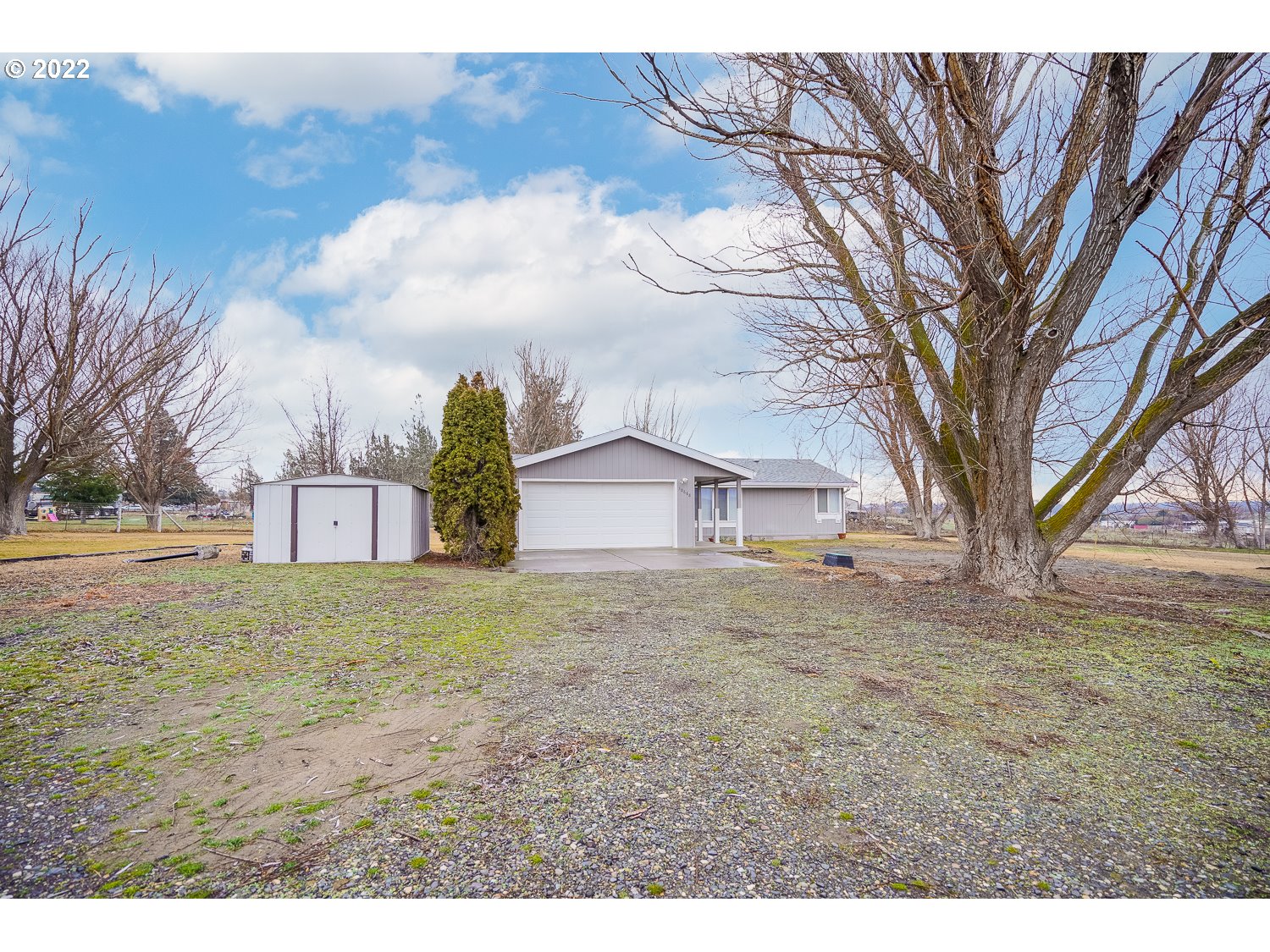 30668 Spring Court Hermiston, OR 97838 - Photo 3 of 23 a view of a house with a yard