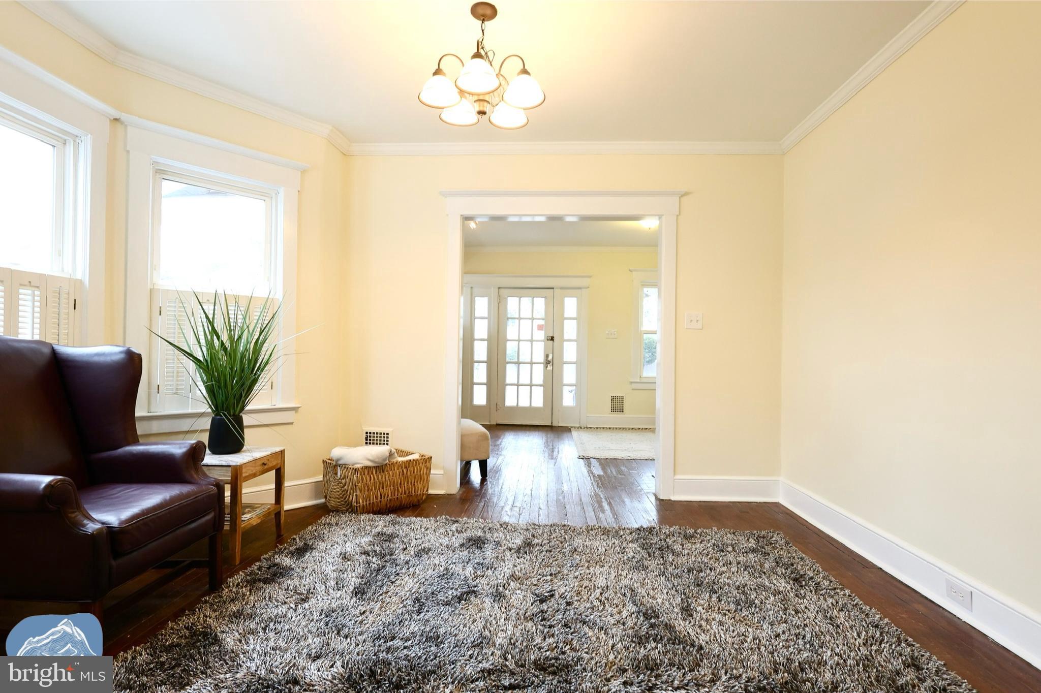 401 2nd Street Riverton, NJ 08077 - Photo 12 of 39 a living room with furniture and a chandelier