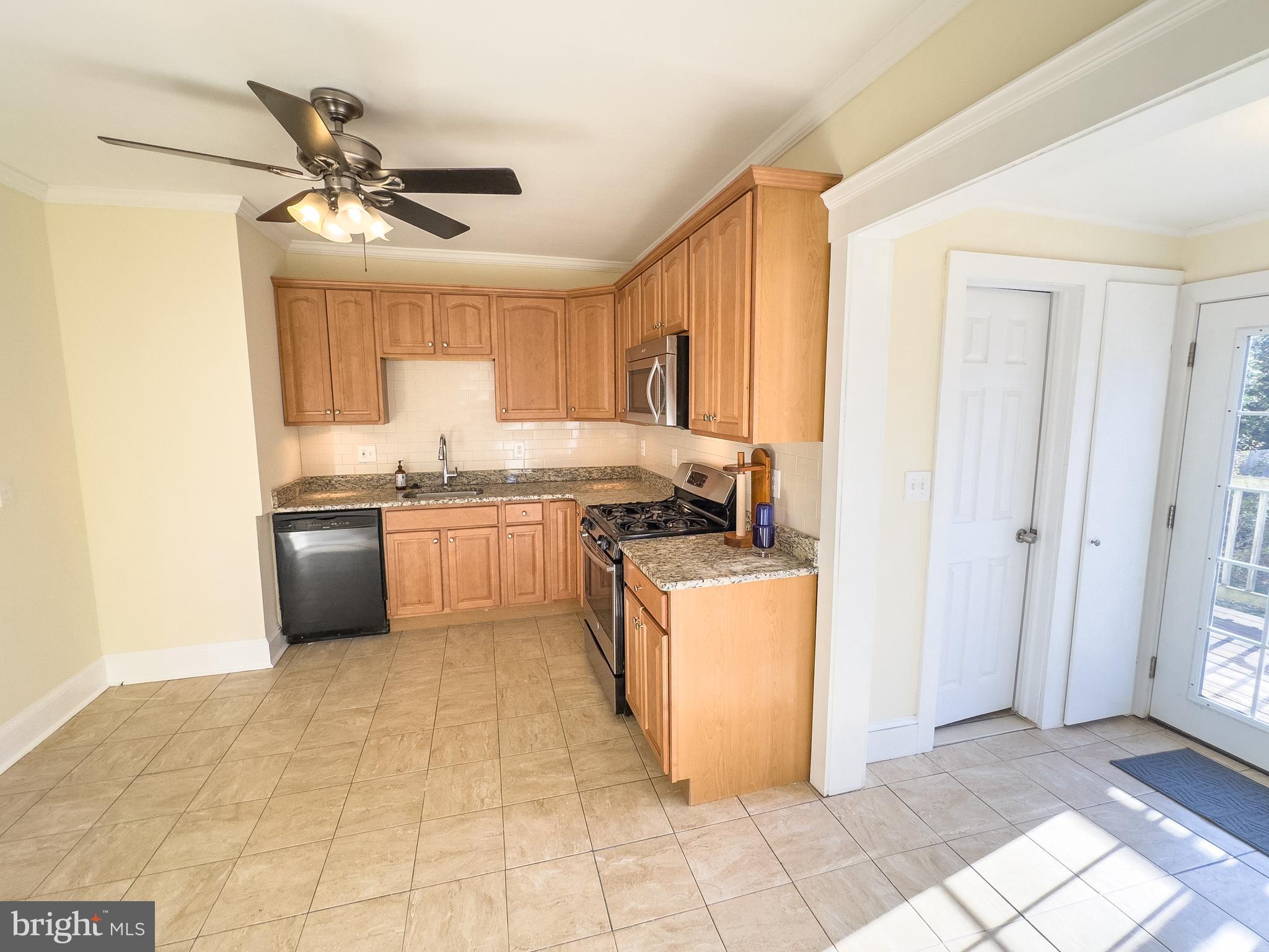 401 2nd Street Riverton, NJ 08077 - Photo 17 of 39 a kitchen with stainless steel appliances granite countertop a stove a sink and a refrigerator