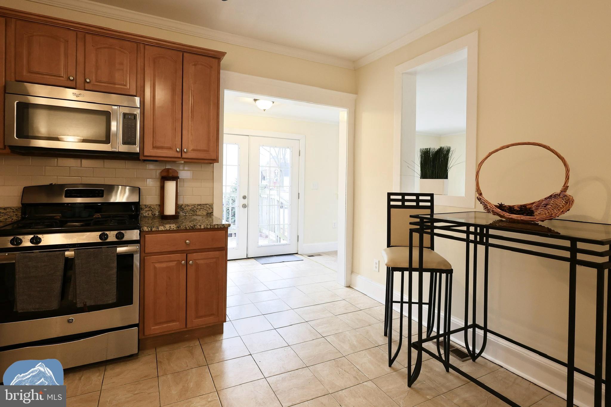 401 2nd Street Riverton, NJ 08077 - Photo 18 of 39 a kitchen with stainless steel appliances a stove a microwave and a sink