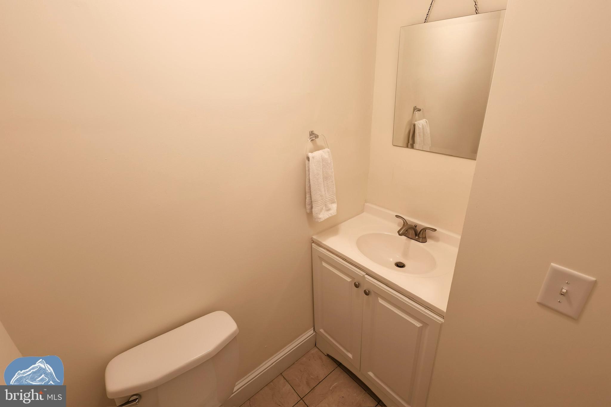 401 2nd Street Riverton, NJ 08077 - Photo 20 of 39 a bathroom with a toilet a sink and mirror