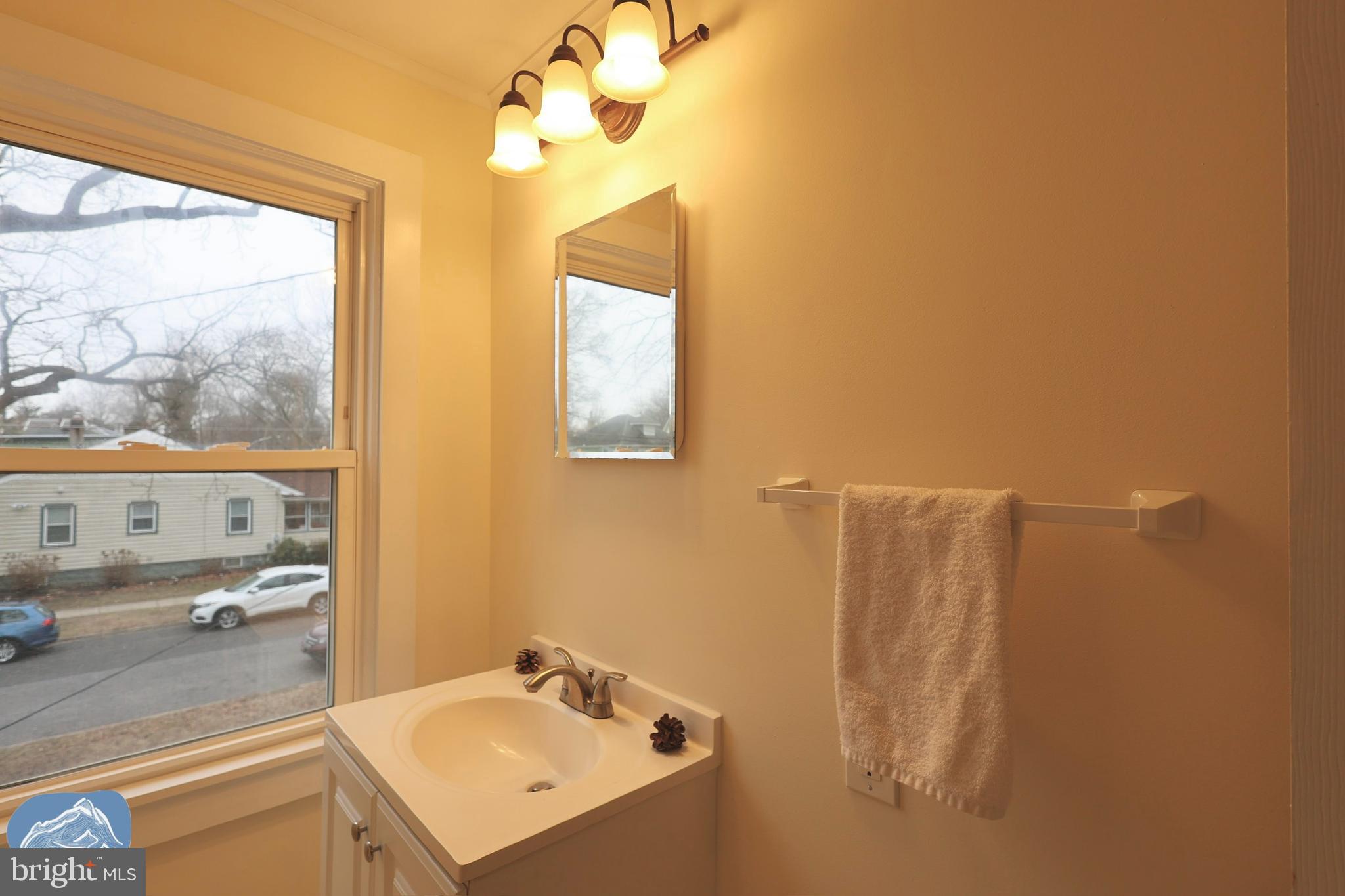 401 2nd Street Riverton, NJ 08077 - Photo 27 of 39 a bathroom with a sink vanity and a mirror