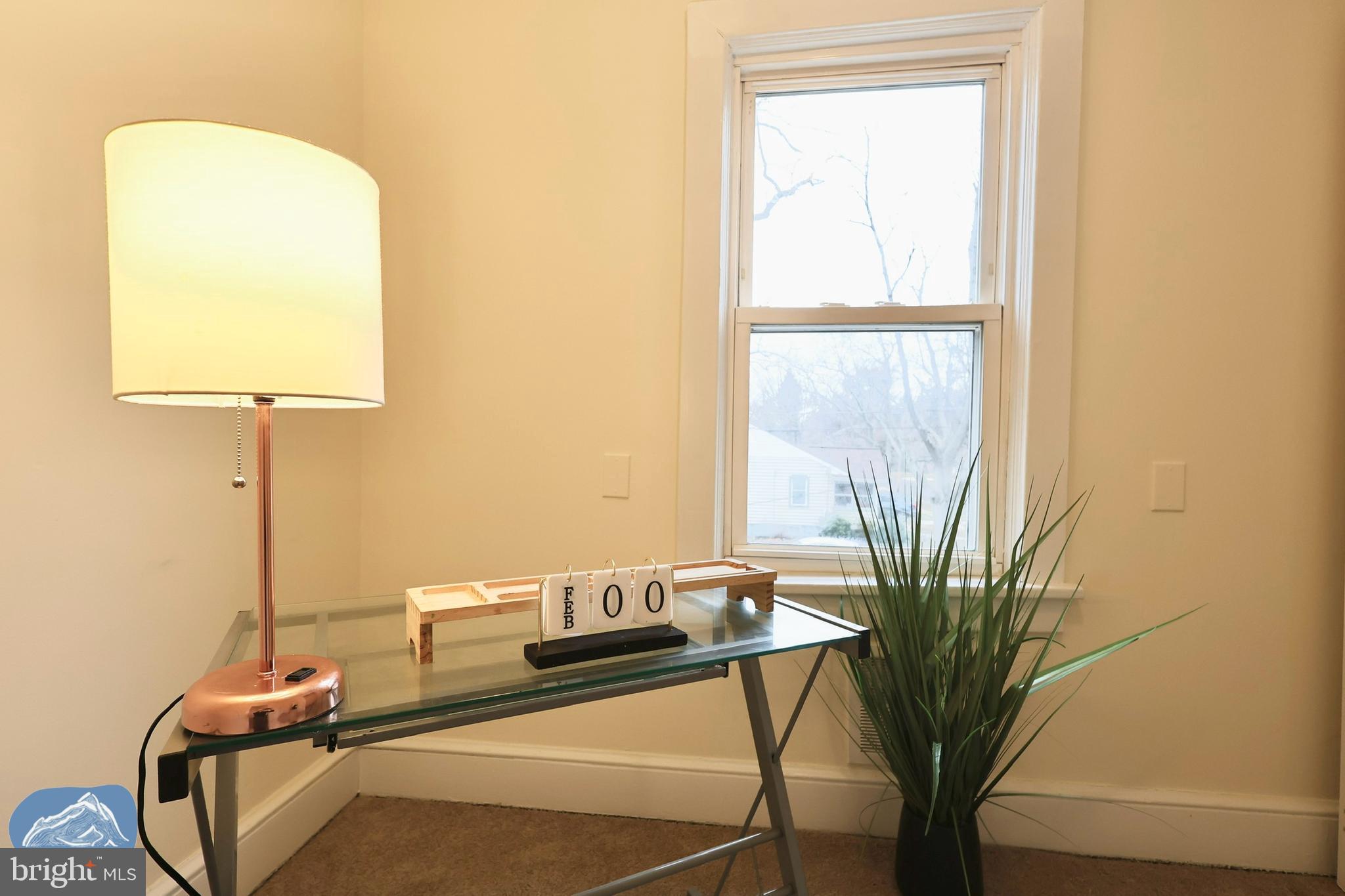 401 2nd Street Riverton, NJ 08077 - Photo 30 of 39 a room with a table and a potted plant