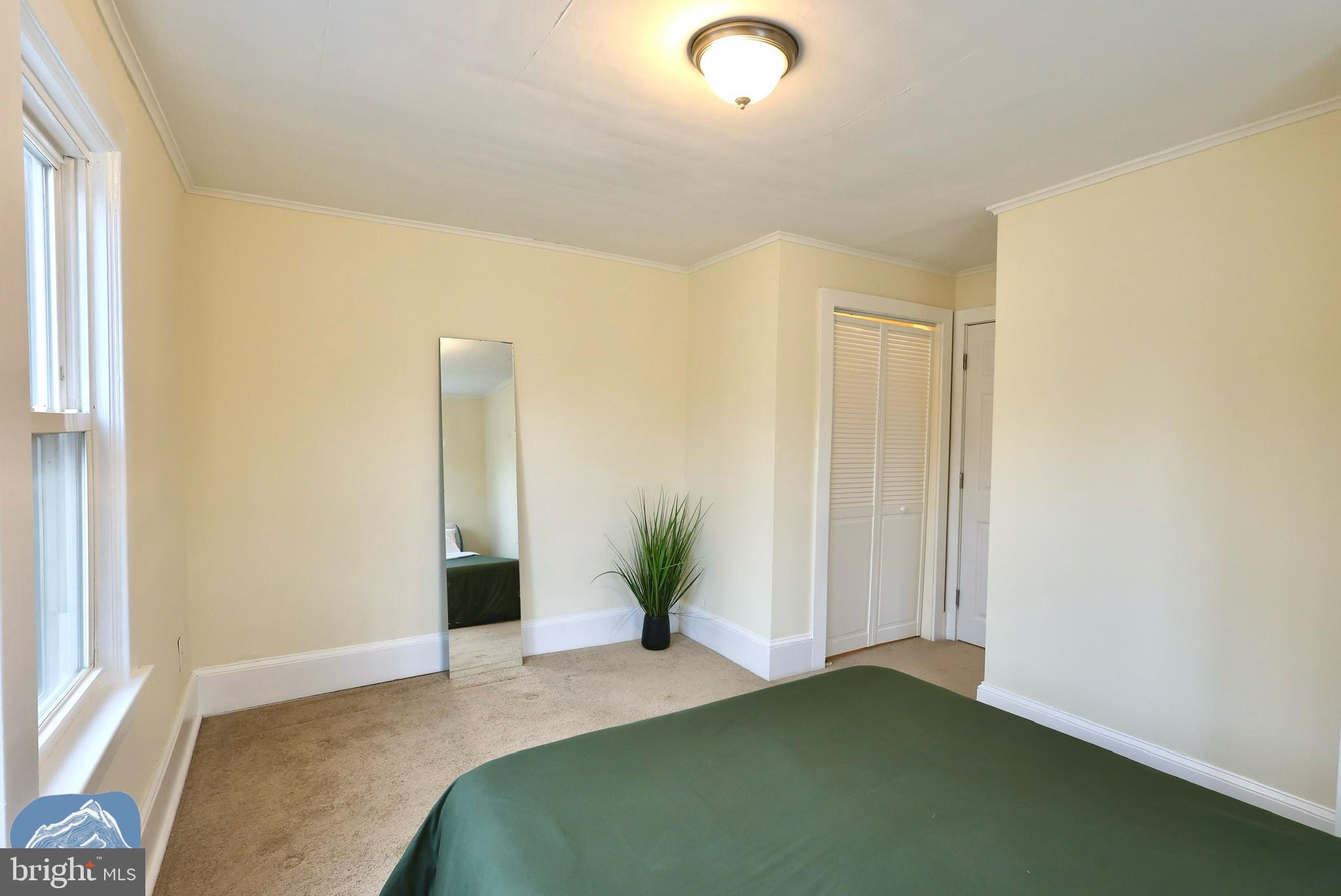 401 2nd Street Riverton, NJ 08077 - Photo 32 of 39 a bedroom with a bed and a window
