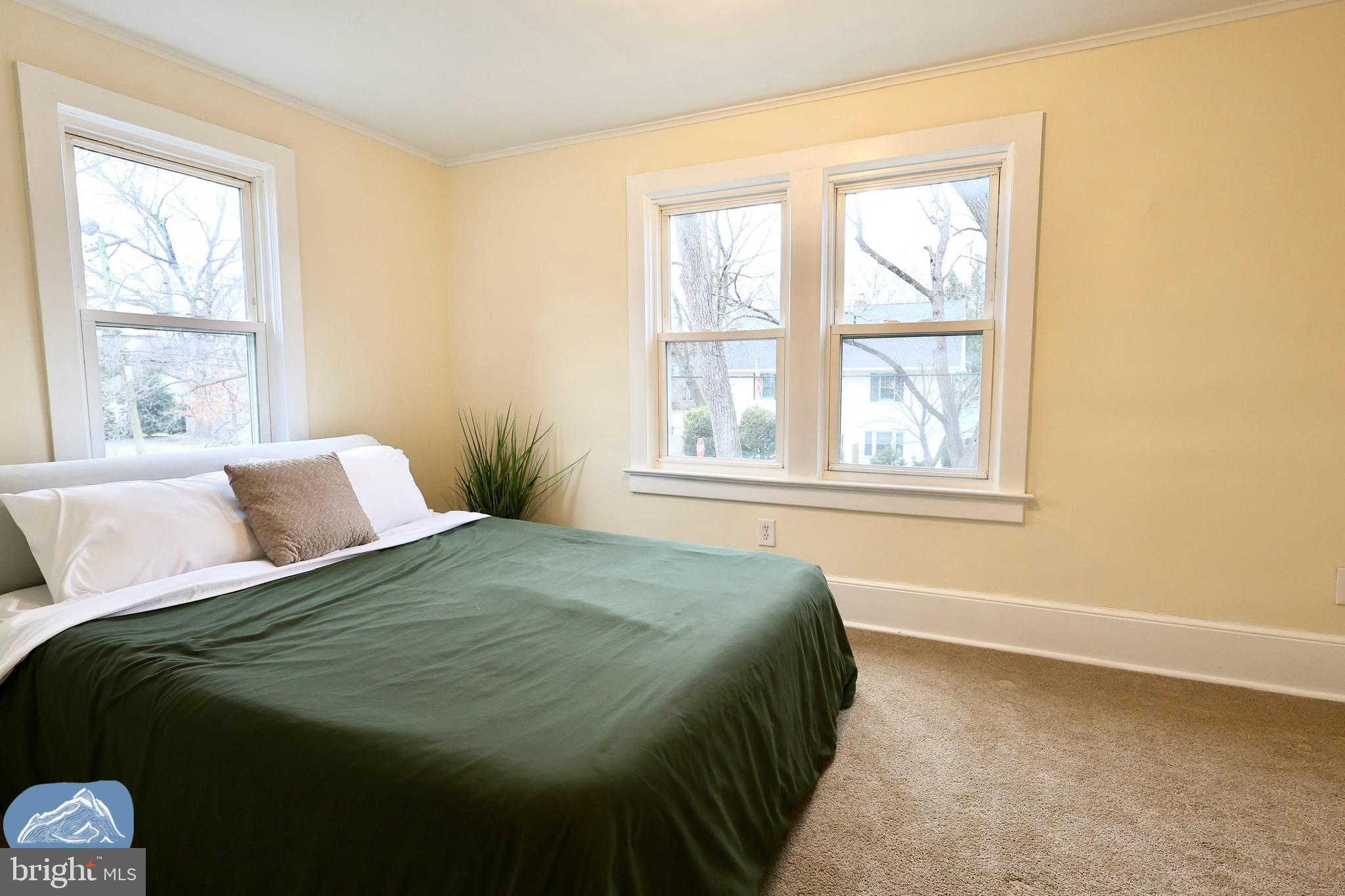 401 2nd Street Riverton, NJ 08077 - Photo 33 of 39 a bedroom with a bed and next to a window