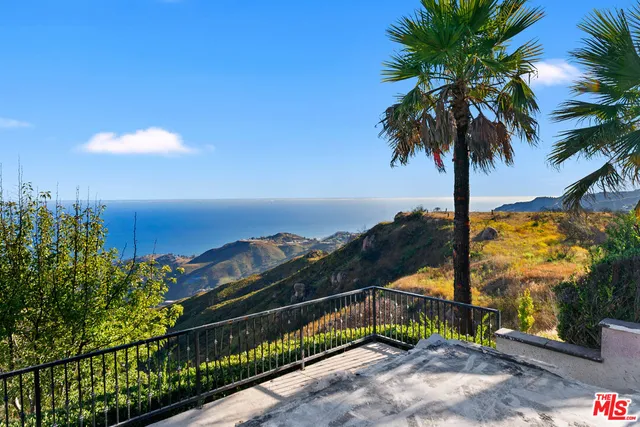 a view of a balcony with a garden