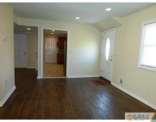 529 New Durham Road Piscataway, NJ 08854 - Photo 11 of 25 wooden floor in an empty room with a window