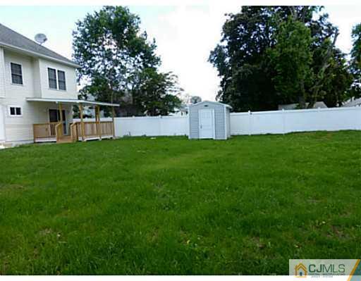 529 New Durham Road Piscataway, NJ 08854 - Photo 25 of 25 a view of an house with backyard space and deck