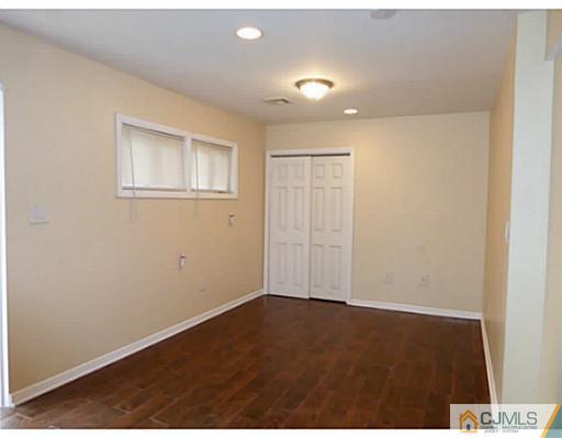 529 New Durham Road Piscataway, NJ 08854 - Photo 6 of 25 an empty room with wooden floor