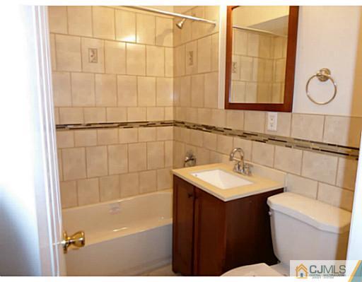 529 New Durham Road Piscataway, NJ 08854 - Photo 7 of 25 a bathroom with a sink toilet vanity and shower