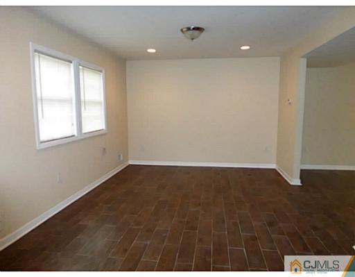 529 New Durham Road Piscataway, NJ 08854 - Photo 8 of 25 an empty room with wooden floor and windows