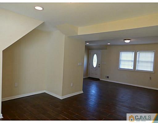 529 New Durham Road Piscataway, NJ 08854 - Photo 9 of 25 an empty room with wooden floor and windows