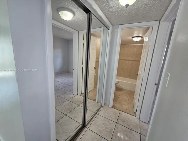 a view of a road with a building in the background