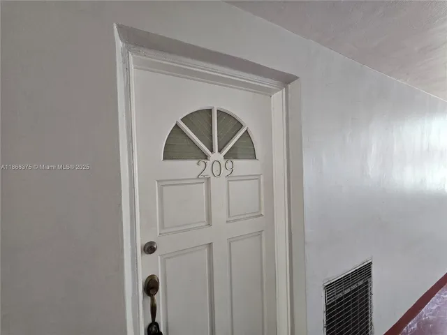a utility room with cabinets washer and dryer