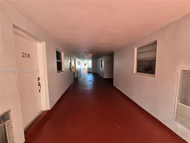 a view of an empty room and window