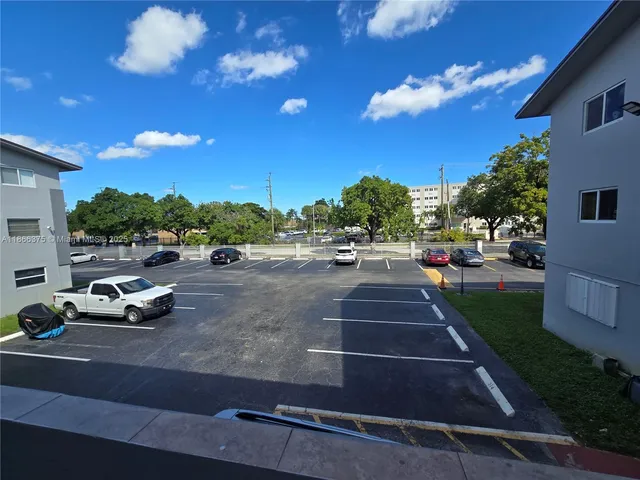 a view of an empty room and a window