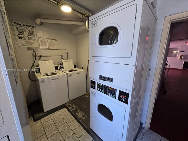 a view of a room with an empty space and a window